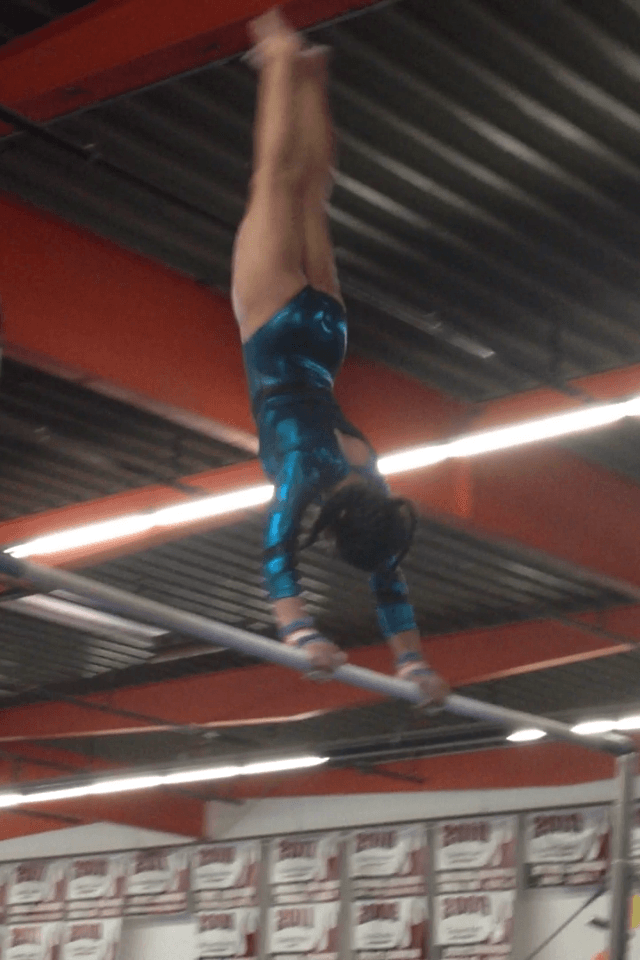 Gymnast Swinging on a Bar